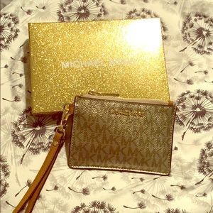 Michael Kors silver wristlet wallet